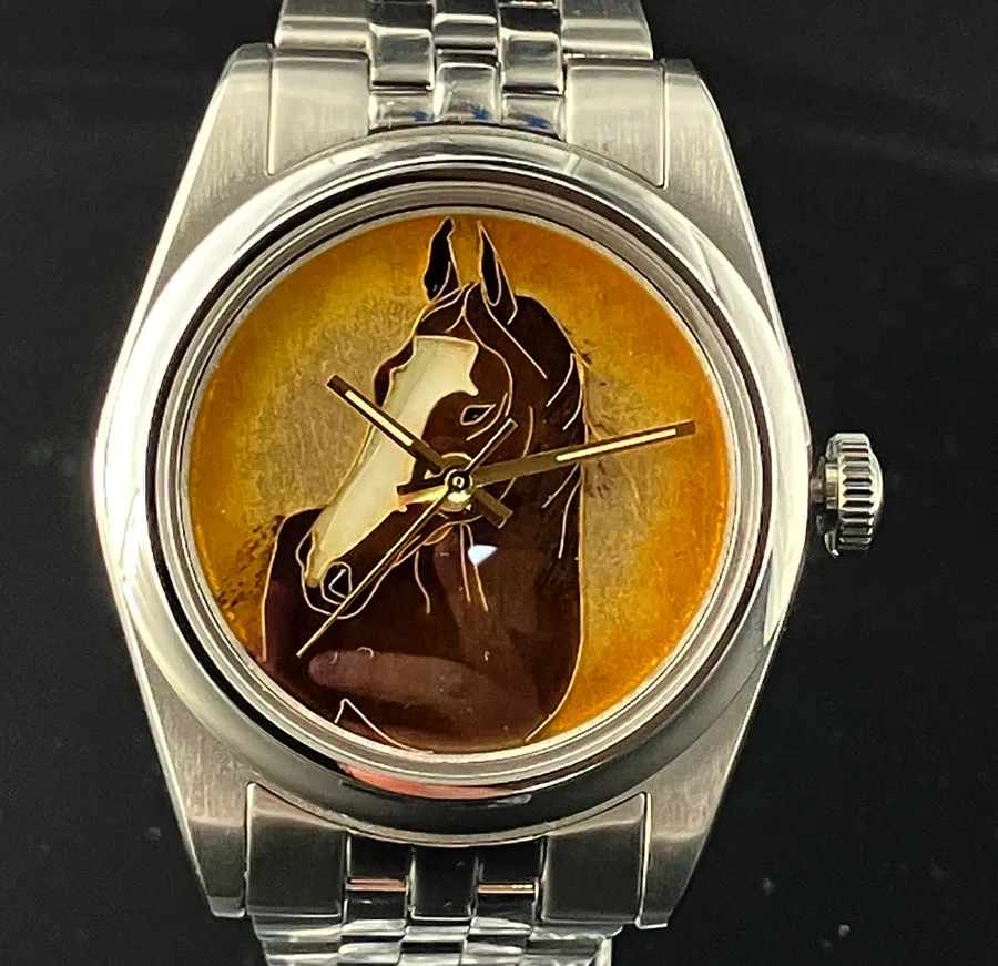 Cincinnati Watch Company Year of the Horse, cloisonné enamel brown horse's head on a golden-orange dial, on a five-link bracelet