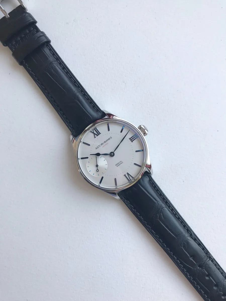 Astor+Banks AB Clásico, silver dial with blue Roman numerals and small seconds, on dark blue leather strap