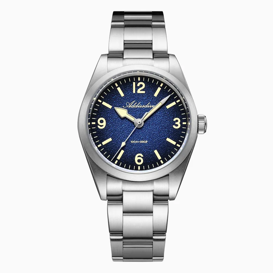 Addiesdive AD2544 with blue textured dial, cream 12-3-6-9 numerals and a three-link bracelet