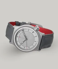 Schofield Light, The Light One, in matt steel with a pale grey dial on a grey strap with red lining
