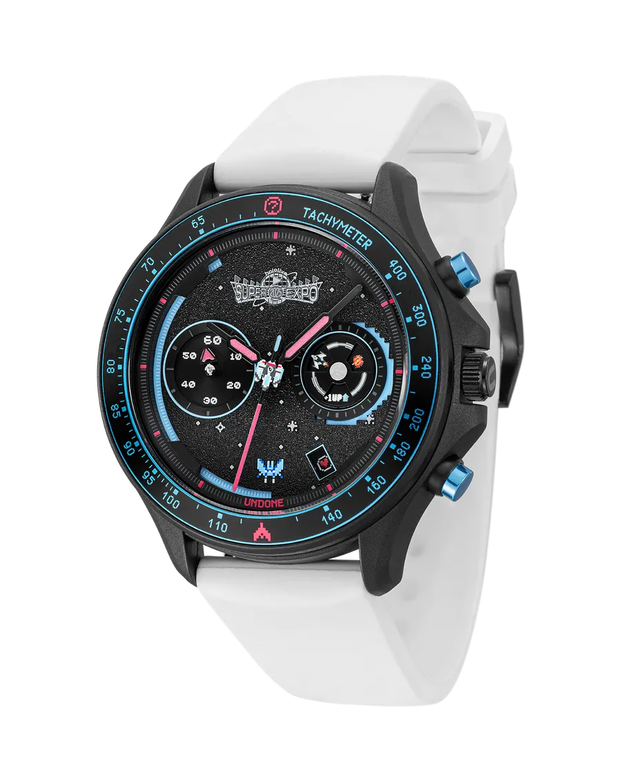 Undone GAMEON Arcade Shooter chronograph with black case, black dial, blue tachymeter bezel and blue pushers on a white strap