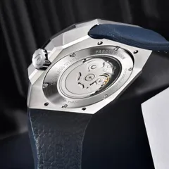 Pagani Design PD-YS010 display caseback held by screws, engraved PD-YS010 and 10BAR/100M, showing a Seiko NH-series movement