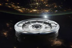 Zelos Cosmos Steel from a low angle, showing the double-domed sapphire crystal and stacked case
