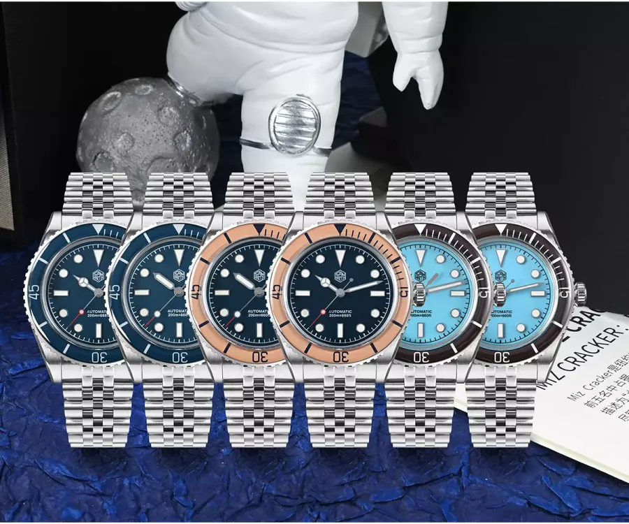 Six San Martin SN0133-G divers with blue dials and blue, salmon and dark brown ceramic bezels on jubilee bracelets