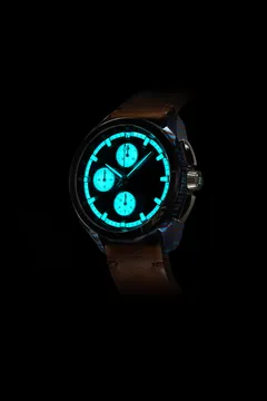 Lume shot of a white-subdial Zelos ZX in a Ti-Damascus case, with fully lumed subdials