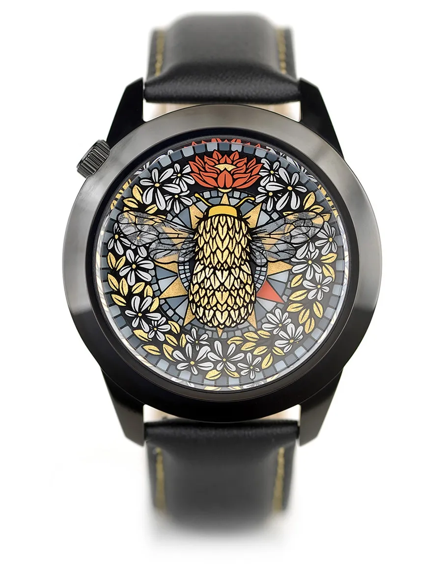 Mr Jones The Golden Hour, gilded bee over a carpet of leaves and flowers, black 45mm case on black leather with gold stitching, front view