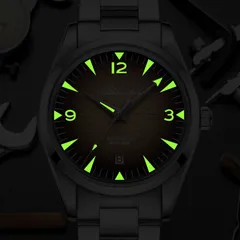 Addiesdive AD2508 lume shot of the yellow dial, glowing green