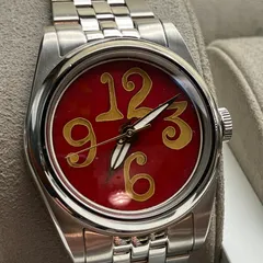 Cincinnati Watch Company The Numbers on Red, oversized gold-coloured 12, 3, 6 and 9 on a red enamel dial, on a five-link bracelet